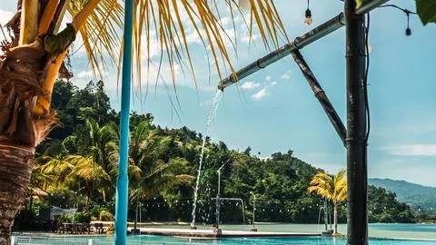 A pool with a waterfall in the background Stock Photos