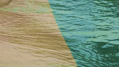 Pool waves over pool border Stock Footage 72443792