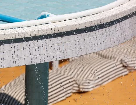 A pool with a white and blue tile wall Stock Photos