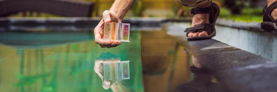 Pool worker checks the pool for safety. Measurement of chlorine and PH of a pool Stock Photos