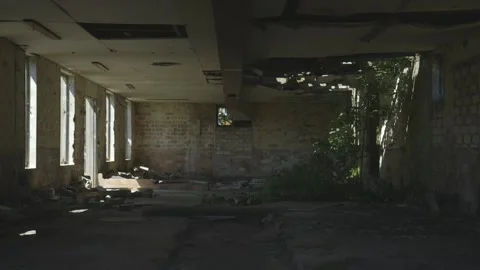 Pools of light in a derelict building Stock Footage 159474331