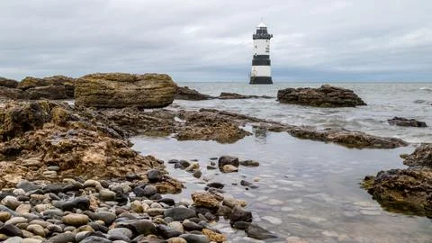 Pools of water by Penmon Lighthouse Stock Photos