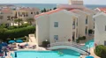 Poolside area with apartments. Sunbathing people near swimming pool HD Footage