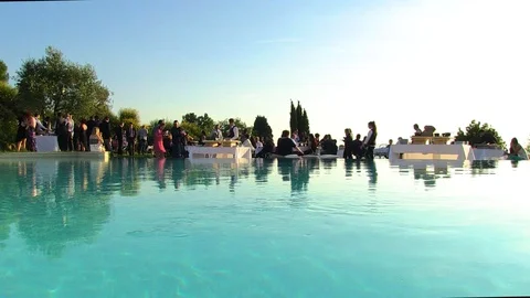 Poolside party at sunset Stock Footage 92586042
