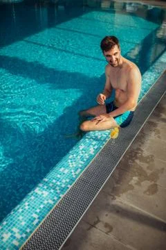 Poolside sunbathing Stock Photos