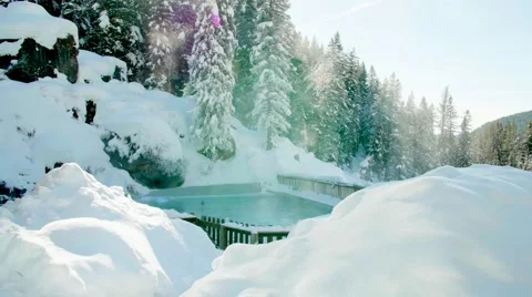 Poolside View of Mountains and Blue Sky in the Snow Tracking Shot 스톡 동영상 64822904