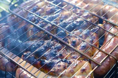 Poor and improper cooking meat on fire. Toasted meat with overcooked crust Foto stock
