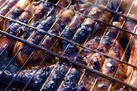 Poor and improper cooking meat on fire. Toasted meat with overcooked crust Foto stock