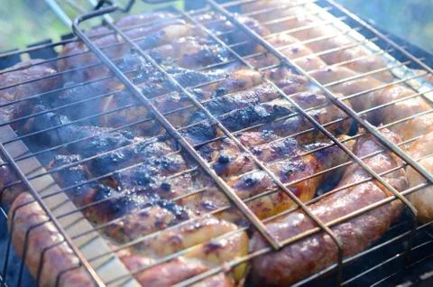 Poor and improper cooking meat on fire. Toasted meat with overcooked crust Foto stock