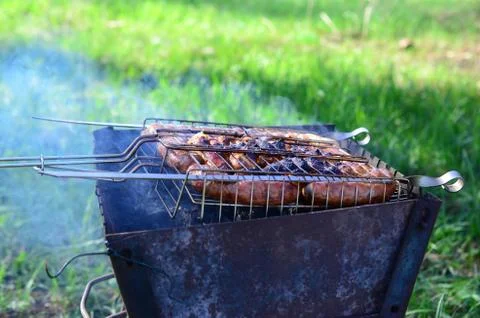 Poor and improper cooking meat on fire. Toasted meat with overcooked crust Stock Photos