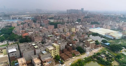 Poor area in China view from a drone, Asian slums near a reservoir shooting from Video stock 114427382
