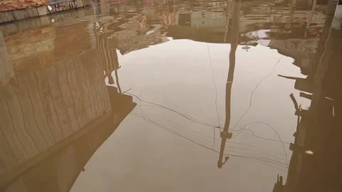 Poor areas of Iquitos. yellow, cloudy, dirty water. slums, wooden houses. Peru Stock Footage 197073435