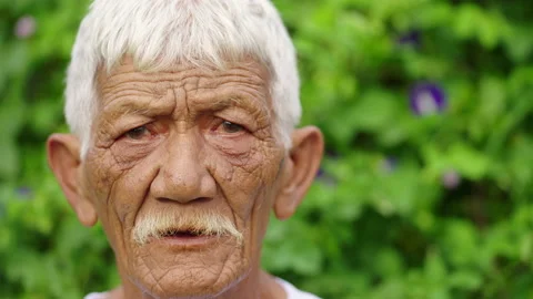 Poor asian farmer portrait, elder with white hair and wrinkles, serious emotion Stock Footage 237690266