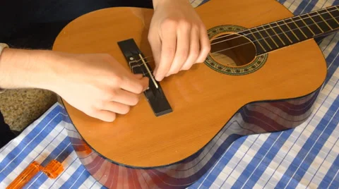 Poor Atempt At Restring Stock Footage 65790355