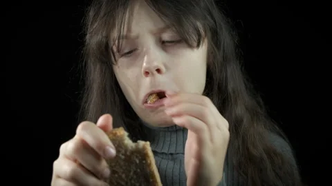 Poor child with slice of bread. Stock Footage 276185929