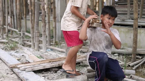 Poor children at the construction site were forced to work. Concept against.. Stock Footage 336942189
