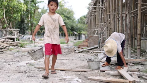 Poor children at the construction site were forced to work. Concept against.. Stock Footage 336942457