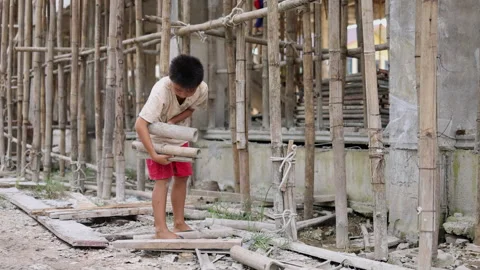 Poor children at the construction site were forced to work. Concept against.. Stock Footage 336942478
