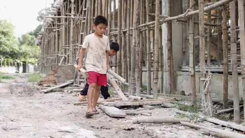 Poor children at the construction site were forced to work. Concept against.. Stock Footage 336942526