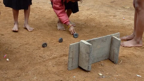 Poor children playing stones game Stock Footage