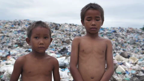 Poor Children Standing With Garbage Dump 스톡 동영상 153688692