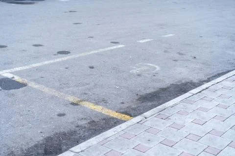 Poor condition of the parking space for the disabled Stock Photos