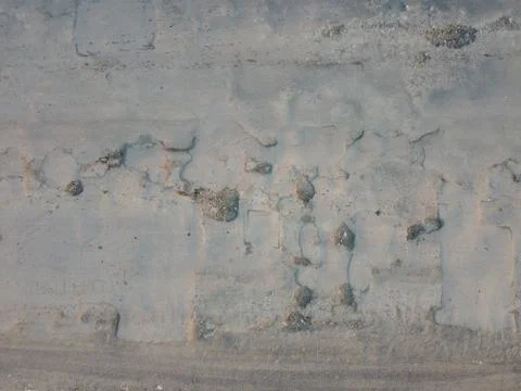 Poor condition of the road surface. Pits and potholes with cracks in the asph 스톡 사진