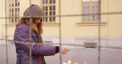 Poor Couple Trying To Warm Up With Fire Stock Footage 128776722
