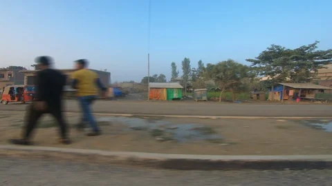 Poor development village with old humber house, green plants and paddy fields Stock Footage 127731882