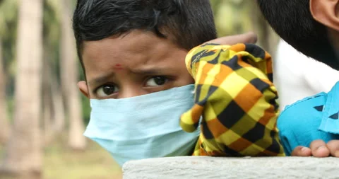 Poor Indian Boy with Mask Stock Footage 144636449