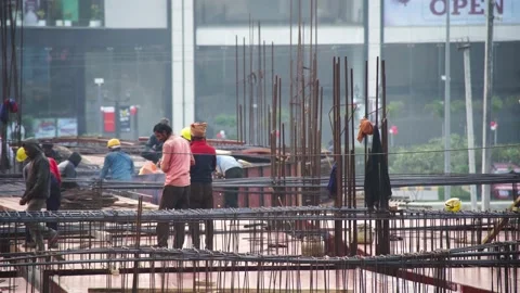 Poor indian laborers and workers wearing minimum protection and no helmets Stock Footage 148498666