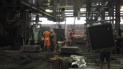 Poor Indian laborers working at coal factory in risky and dangerous Stock Footage 198020525