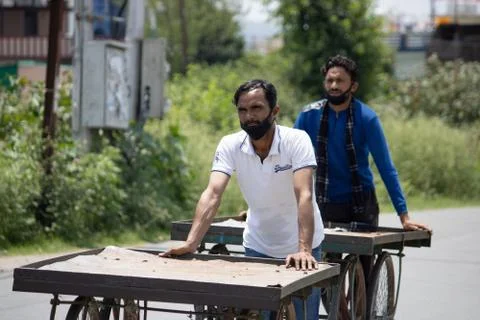 Poor Indian people doing work by wearing masks, Stock Photos