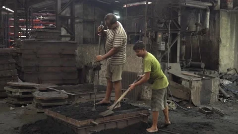 Poor Indian workers working at factory with no safety helmet and bare Stock Footage 198020645