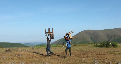 Poor Man carrying a Chair Stock Footage 293124166