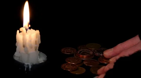 Poor Man Counting Money by candlelight Stock Footage