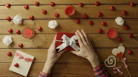Poor man gets empty present box as valentine day gift, top view Stock Footage 87979292