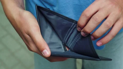 The poor man looks at the empty wallet Stock Footage 159543226