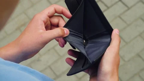 The poor man looks at the empty wallet Stock-Footage 159657335