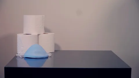 Poor man paying an excessive amount of money for a single toilet paper roll 스톡 동영상 130153244