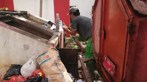 Poor man picking Up trash from trash bin Stock Footage 219842056