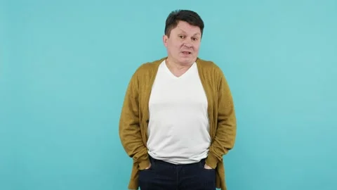 Poor man showing empty pockets inside out, having no money, debt problems, Stock Footage 150532098