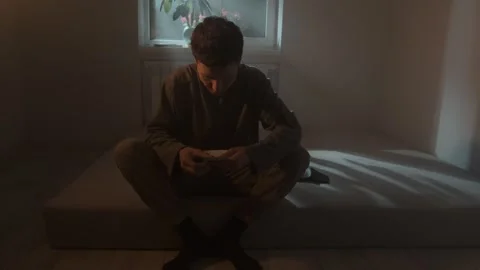 Poor man taking last bills from wallet and counting money, financial crisis in Stock Footage 312273818