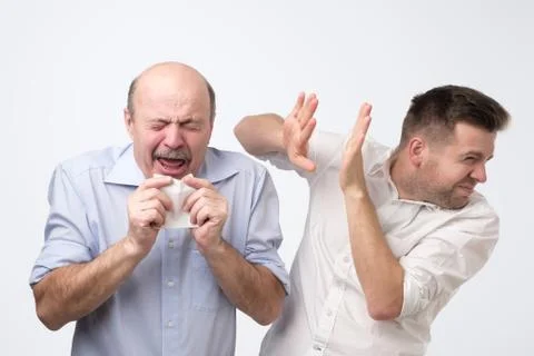 Poor old guy has terrible grippe. Studio shoot Stock Photos