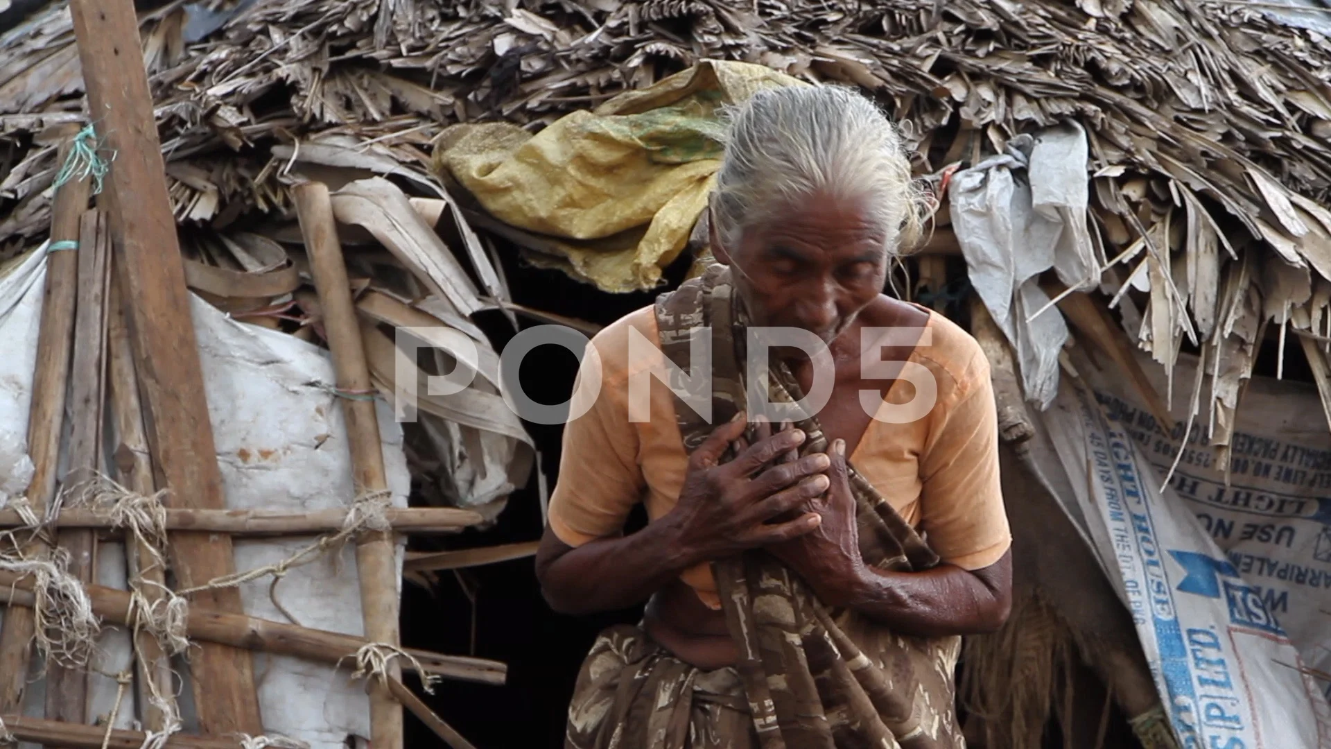 Poor old lady in rural village in India