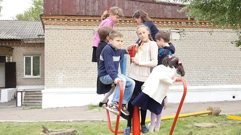 Poor Orphans Children playing together in a Yard, open Day in Orphanage Ukraine Stock Footage 107818116