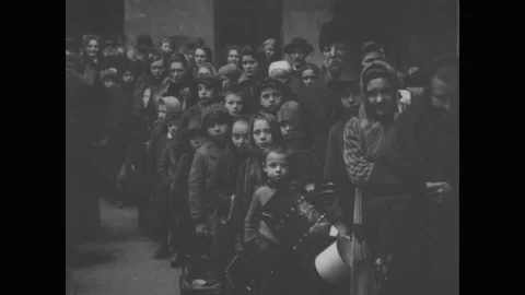 Poor people stand in queue at municipal soup houses - 1936 Stock Footage 93367414