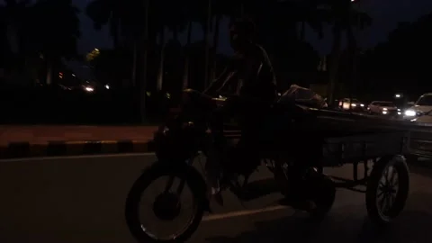 Poor rikshaw driver in night Stock Footage 205255347