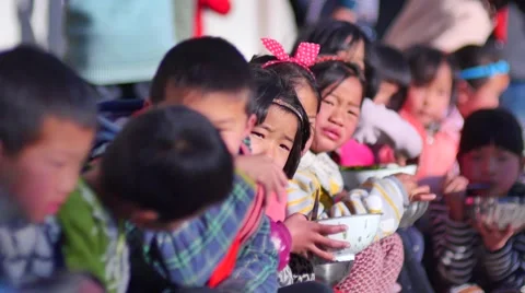 In poor  school the students eat lunch Video stock 67619196