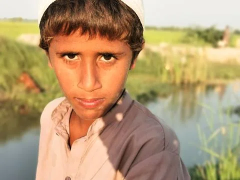 A poor staring hungry orphan boy and sad expression on his face and his face  Stock Photos